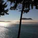 Fog painting a beautiful picture by wrapping around Allen And Burrows Island